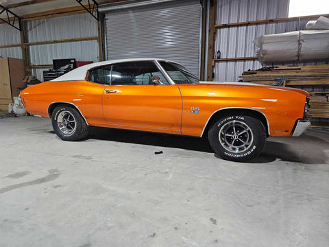 Showroom Smooth Dreamsicle Orange Basecoat Paint Gallon Ready To Spray Mix With Slow Reducer For Zero Hassle Street Car Restorations And Bumper To Bumper Shine on a classic muscle car in a garage.