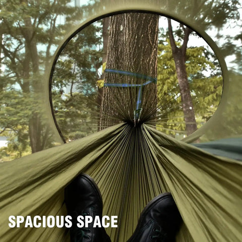View from inside Mosquito Net Camping Hammock With Lightweight Parachute Nylon, feet visible, setup between trees