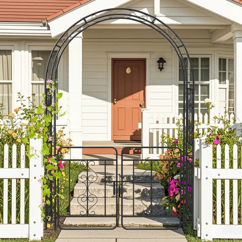 Garden Arbor With Gate Metal Arch Trellis for Climbing Plants and Vines in front of a house with flowers