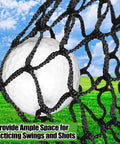 Close-up of a golf ball caught in the 10x10 Practice Net Heavy Duty Nylon Hitting Net For Garage And Backyard Ready To Roll Durable Indoor Outdoor Swing Training Netting With Strong Frame Support And Easy Setup, showing black nylon netting outdoors.