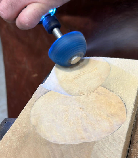 Badass Two Inch Tungsten Carbide Contour Wheel For Die Grinders, Coarse Grit Wood Carving And Heavy Material Removal, Includes No Hassle Fitting Adapter in action on wood surface.
