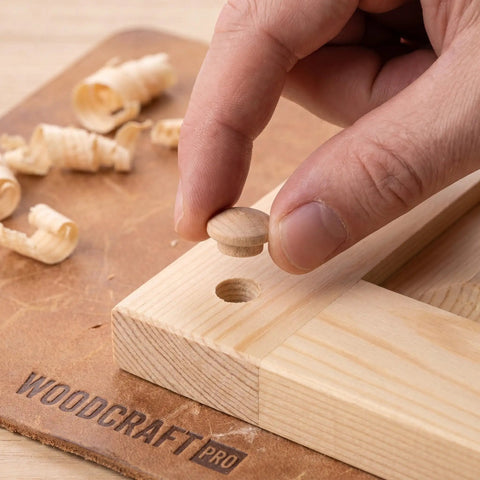 Placing 120Pcs Wood Screw Hole Plugs With Top for Wooden Furniture on wooden surface, showing natural grain finish and easy install