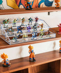 Clear Acrylic Miniature Display Shelf 2.75 Inch Wide Three Tier Stand showcasing figures on wooden shelf