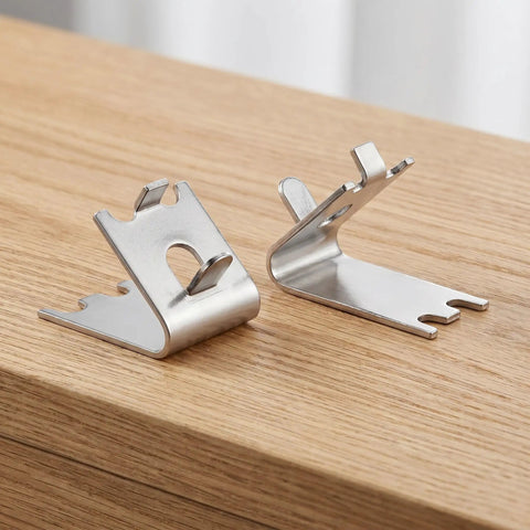 Heavy Duty Stainless Steel Freezer Shelf Clips Set on wooden surface, showing angled design for secure shelving support.