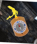 Orienteering Compass Ruler And Pointer For Hiking And Camping, acrylic tool with yellow lanyard on wood surface