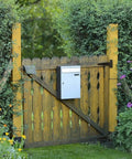Wooden garden gate with mailbox, featuring hinges similar to Two Pack Zinc Alloy Hinges For Cabinets And Jewelry Boxes, Retro Iron Hardware.