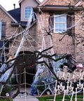 Massive 200 Inch Halloween Spider Web Plus 59 Inch Giant Fake Spider Epic Yard Haunt Decor Set With Realistic Arachnid at a decorated house.