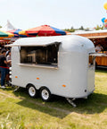 Kickstart Your Food Truck Trailer And Hot Dog Cart Venture With Commercial Mobile Kitchen Rig For Coffee Shop And Ice Cream Stand Business Hustle Dope Full Setup, grey trailer with open serving window.