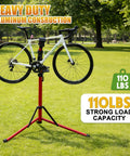 Heavy Duty Bike Repair Stand With 360 Degree Clamp Portable Aluminum Work Stand Supports Up To 110 Lbs Tool Tray For Easy Maintenance Fits Mountain And Road Bikes And Electric Bikes Red holding a bicycle in a park