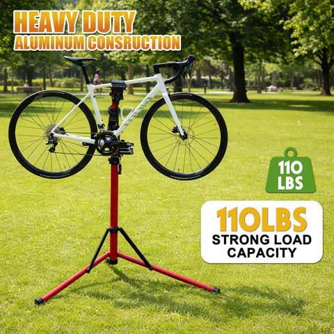 Heavy Duty Bike Repair Stand With 360 Degree Clamp Portable Aluminum Work Stand Supports Up To 110 Lbs Tool Tray For Easy Maintenance Fits Mountain And Road Bikes And Electric Bikes Red holding a bicycle in a park