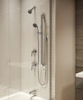 Modern bathroom with Origins Tub and Shower Trim with Diverter and ADA Metal Lever Handle, polished chrome finish visible.