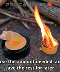 Fire Strip Roll 50-Foot Weatherproof Waxed Fire Starter Tinder Tape igniting beside roll and wooden sticks.
