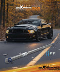 Rear Adjustable Track Bar For Ford Mustang 2005-2014, Adjustable Eye To Eye Length 1032mm To 1092mm (40.6in To 43in), PU Bushing With Grease Zerk Fitting, Centers Axle For Beef Up Handling And Smooth Ride installed near black Mustang