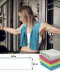 Woman using gym equipment with blue towel from 4 Pack Cooling Towels For Gym And Outdoors 40x12 Inches Soft Breathable Microfiber Instant Chill