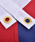 Close-up of Heavy Duty 3x5 Outdoor American Flag Built To Last In High Wind With UV Protection Sewn Stripes, brass grommets visible