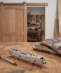 Heavy Duty Sliding Door Rollers Replacement Kit With Silent Stainless Steel Bearings for Silky Glass Track Glide laid on a workbench with tools.