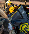 Hunter using Scent Safe Deluxe Travel Scent Bag For Hunting Gear And Clothing Keeps Your Scent Hidden And Your Gear Scent Free.