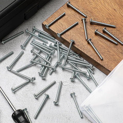 Bulk Pack 8-32 X 1-3/4 Inch Zinc Plated Cabinet Knob And Pull Machine Screws Kit scattered on wood surface