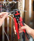 3 In 1 Self-Adjusting Wire Stripper And Crimping Tool Kit For 10-24 AWG with Heat Shrink Connectors in use, close-up.