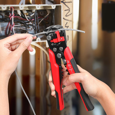 3 In 1 Self-Adjusting Wire Stripper And Crimping Tool Kit For 10-24 AWG with Heat Shrink Connectors in use, close-up.