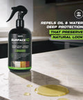 Hardcore Penetrating Sealer Spray For Concrete Brick And Unsealed Grout Leaves Invisible Stain Shield on countertop with spills.