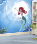 Part Of Your World The Little Mermaid Peel And Stick Wall Mural By RoomMates on a child's bedroom wall with ocean decor.