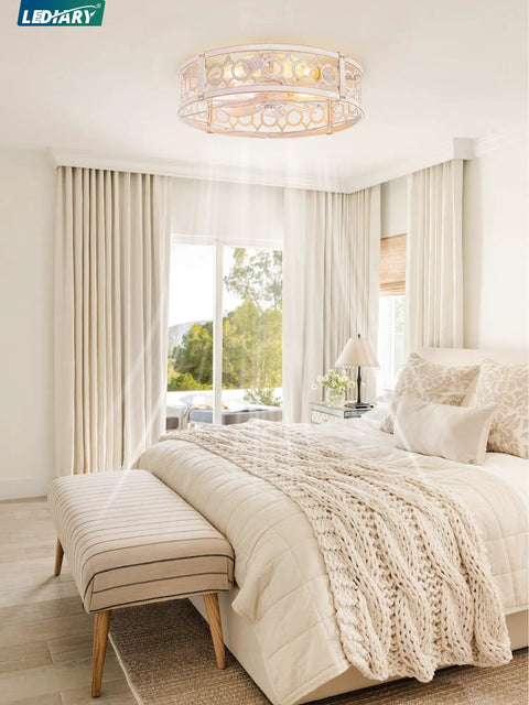 20Inch Caged Low Profile Ceiling Fan With Integrated Light And Remote Control In Refined White Gold Finish above a cozy bedroom.