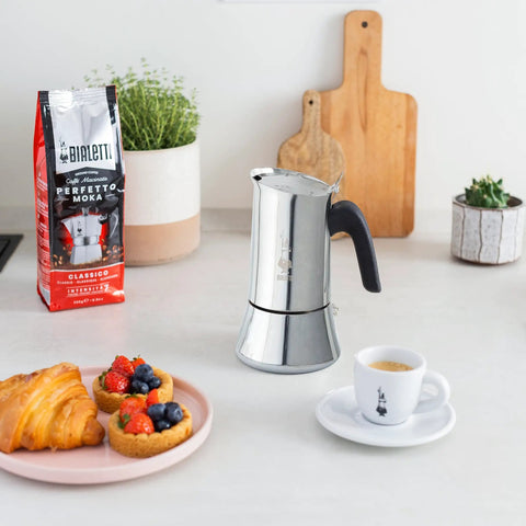 New Venus Induction Stovetop Coffee Maker 6 Cup Stainless Steel Silver on kitchen counter with breakfast.