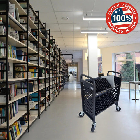 Slick 32 Device Laptop Charging Cart With Built In Surge Protection Acts As A Hella Efficient Chromebook And Tablet Storage Station For Classroom Labs in a library setting.