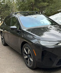 Front-side view of BMW with Roof Rack Cross Bars For iX 2020 And Up No Drilling Aluminum T Slot Design Lockable