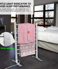 Eight Bar Towel Warmer With Timer For Bathroom And Laundry, Portable Free Standing Heated Rack, holding pink towels, in bedroom.