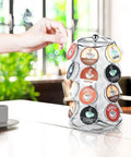 Person using K Cups Pod Carousel Cup Holder With 24 Slots Spins 360 Degrees Lazy Susan Chrome Finish on kitchen counter