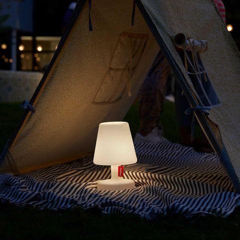 Tiny Rechargeable LED Lamp 2.0 Go Anywhere Dimmable Table Light glowing inside a tent at night, ideal for indoor and outdoor use
