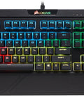 Top Tier Mechanical Gaming Keyboard With Butter Smooth Cherry Red Linear Keys And Killer Per Key RGB Backlighting For Your PC Rig Includes USB Passthrough And Macro Support For That Competitive Edge You Deserve, aerial view with colorful RGB backlighting.
