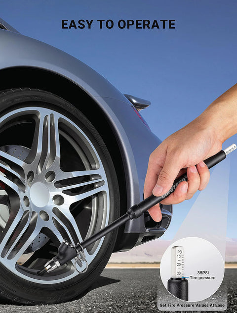 Side view of LUMITECO tire pressure gauge, handheld black pencil-style gauge with extended tube near car tire.