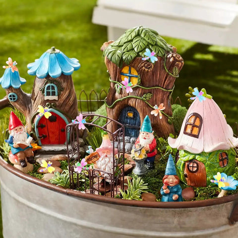 Miniature fairy garden scene with houses and gnome figurines, illustrating decor similar to 90 Pieces Mini Resin Dragonflies Figurines.