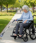 Person using a 34 Inch Extra Long Reacher Grabber With Foldable Gripper And Rotating Jaw for easy pickup of keys from wheelchair.