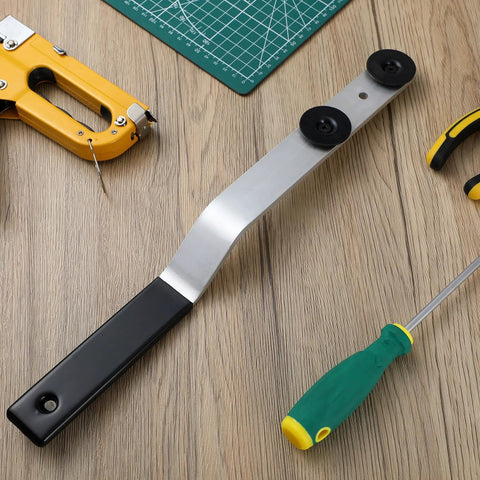 16-inch metal duct stretcher tool with offset black handle and sliding washers on a wood workbench