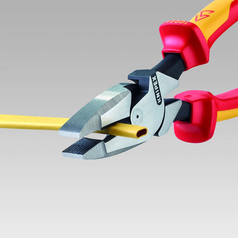 9.5 Inch Insulated Ultra-High Leverage Lineman's Pliers With Cable Puller, No-Sweat Setup, holding yellow cable