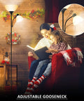 LED Torchiere Floor Lamp With Adjustable Reading Light for Bedroom and Living Room, Matte Black, cozy holiday setting.