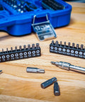 Master Grade 150 Piece Socket Set With Quarter Inch And Half Inch Drives Featuring Super Lock Sockets deep and short profiles on a wooden table.