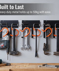 16 Inch Beefy Heavy Duty Metal Wall Mount Garden Tool Organizer with adjustable hooks holding tools in a garage.