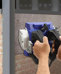 Using the Heavy Workhorse 1300W Handheld Wall Planer against a wall for efficient paint stripping.