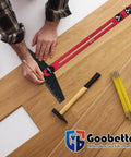 Hands using a square and pencil on wood with Built Like A Tank Stair Tread Jig And Adjustable Template Locking Bars.