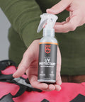 Outdoor Gear UV Protectant and Conditioner Spray for Plastic, Vinyl, and Neoprene That Shields Against Sun Damage, 4 Fl Oz bottle held