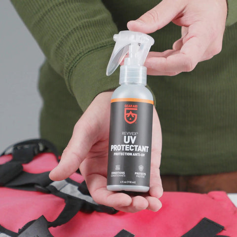 Outdoor Gear UV Protectant and Conditioner Spray for Plastic, Vinyl, and Neoprene That Shields Against Sun Damage, 4 Fl Oz bottle held