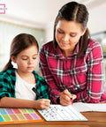 Teacher and student using Dry Erase Division And Place Value Whiteboards 9x12 Inch Double Sided Lapboards for math practice.