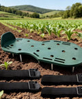 Lawn Aerator Shoes With Spikes For Heavy Duty Yard Work Four Adjustable Straps For Easy Secure Fit, Green PP Plastic in a field.