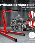 Heavy Duty 2 Ton Hydraulic Engine Hoist Cherry Picker Shop Crane With Telescopic Boom and Dual Wheel Casters lifting an engine.