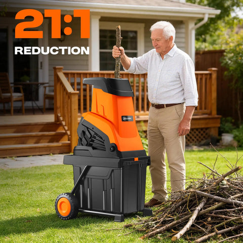 Man using Powerful Electric Wood Chipper Shredder For Quick Yard Cleanup With 1800W Power, 4500 RPM, 10 Gallon Bin